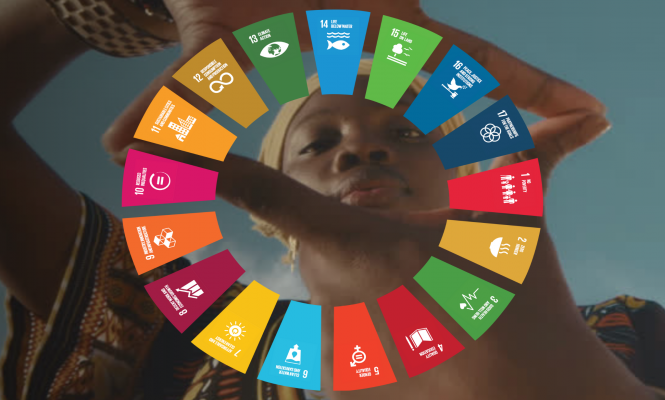Woman holding all the SDGs